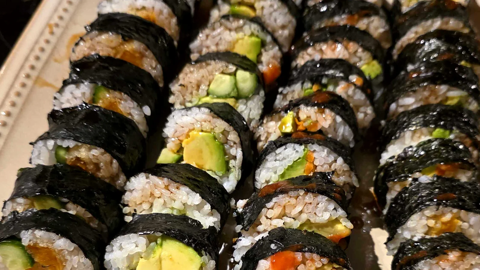 Homemade vegan sushi rolls with avocado and vegetables